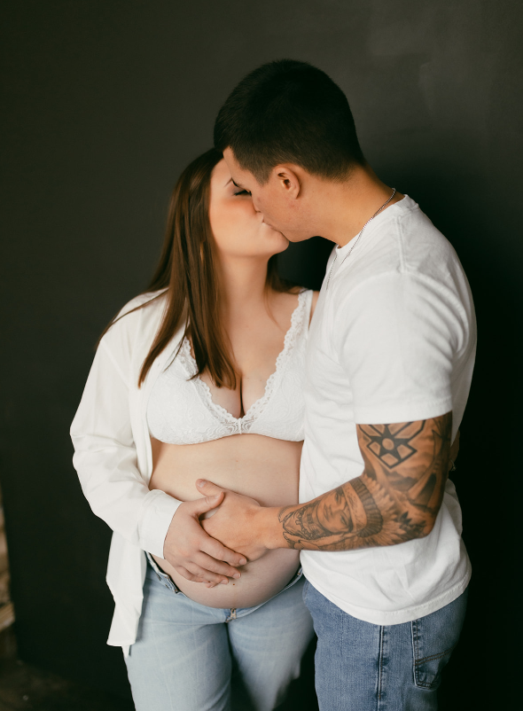 Maternity Session with couple wearing white shirts and denim jeans