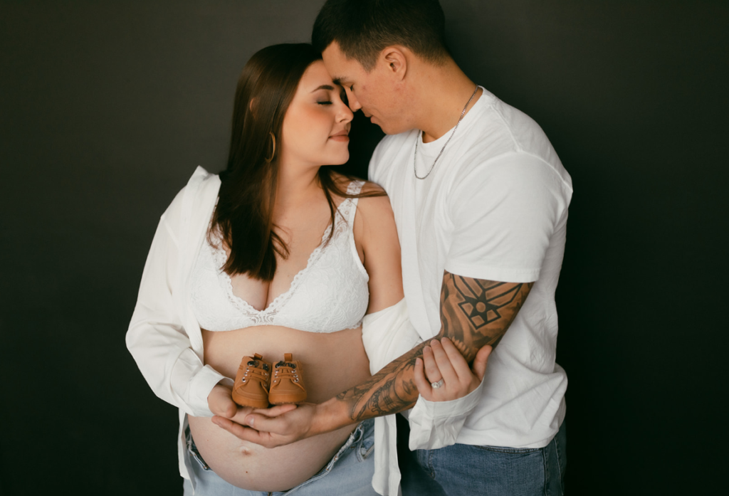 Maternity Session with couple wearing white shirts and denim jeans