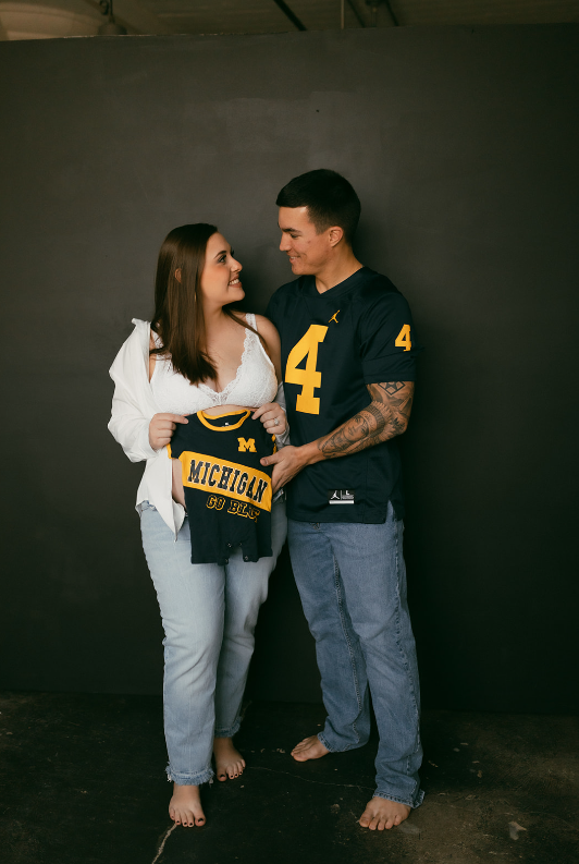Sports jersey during maternity photos