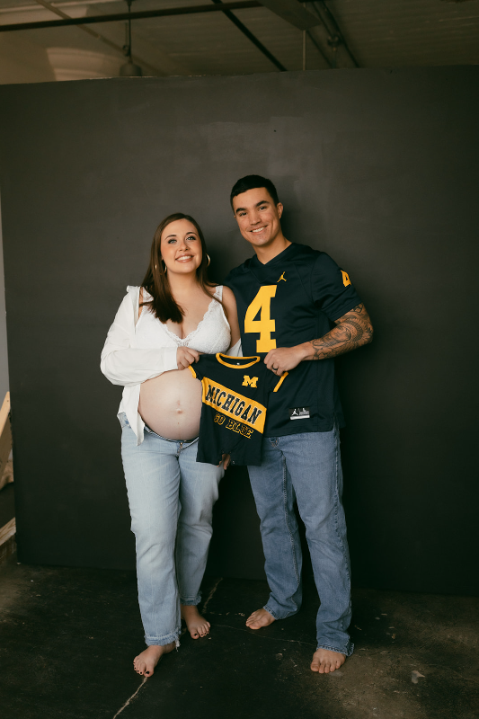 Sports jersey during maternity photos