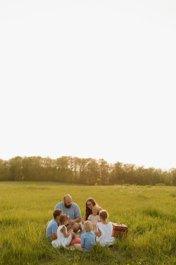 Annika Frame photographed this family session in Blue Mounds, Wisconsin where they had a picnic during golden hour