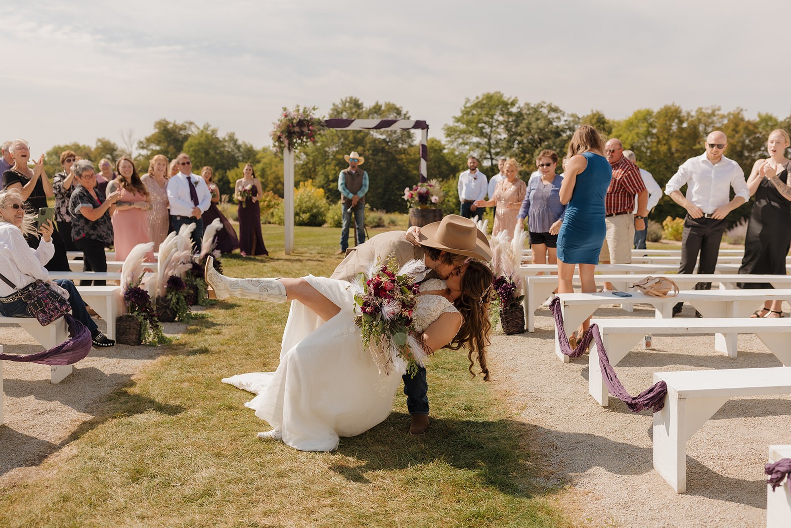 bride and groom dip after their wedding ceremony