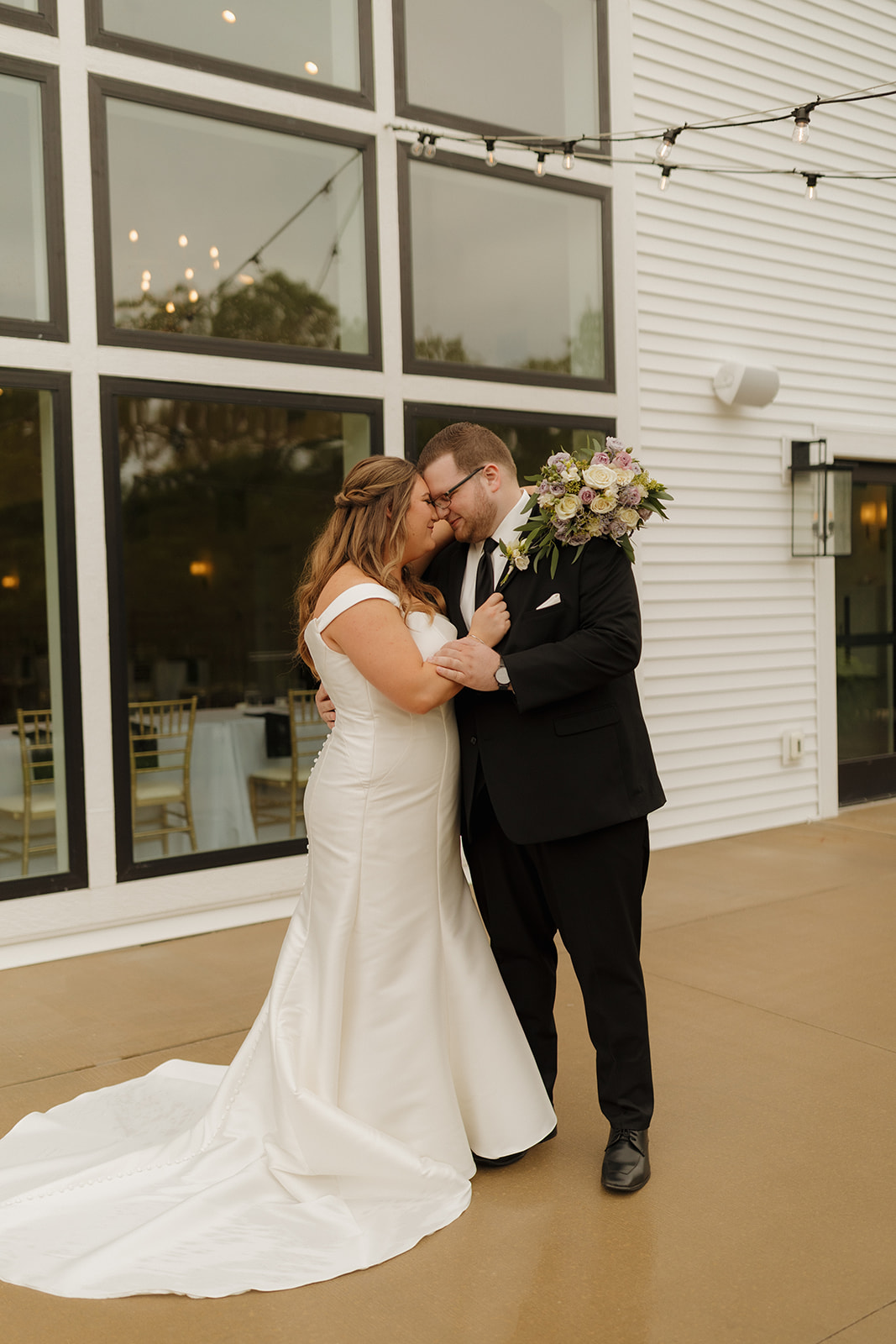 Bride and groom sharing a quiet moment outside The Eloise wedding venue near Madison, Wisconsin
