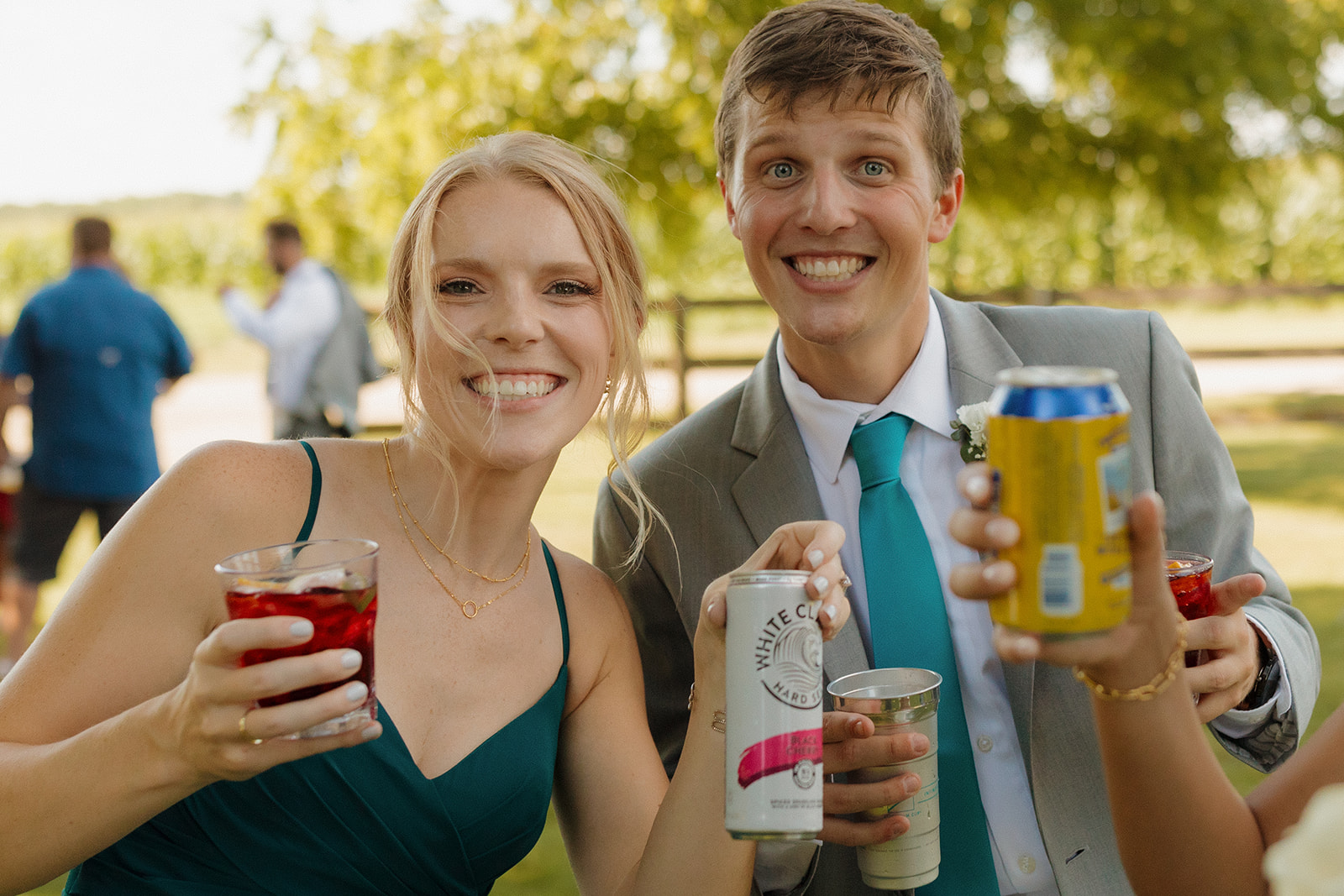 Wedding guests enjoying cocktail hour while bride and groom are taking photos 