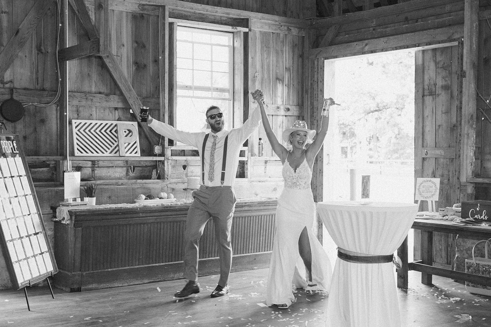 Bride and groom entering evening reception as newly married husband and wife while bride wears sparkly cowboy hat