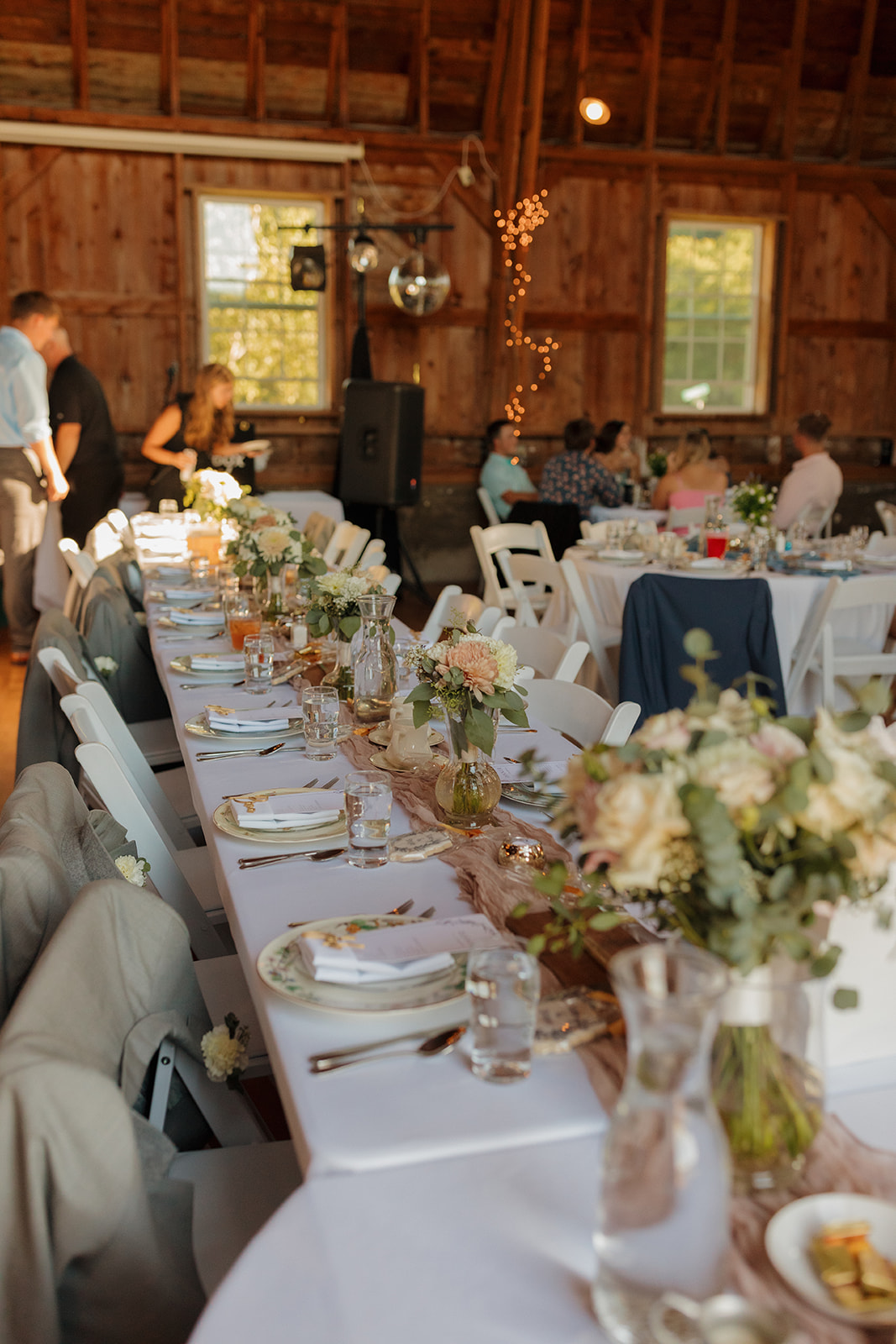 Intimate wedding reception inside barn for a unique take on the barn style wedding - more outdoor wedding ideas that make Wisconsin weddings stand out