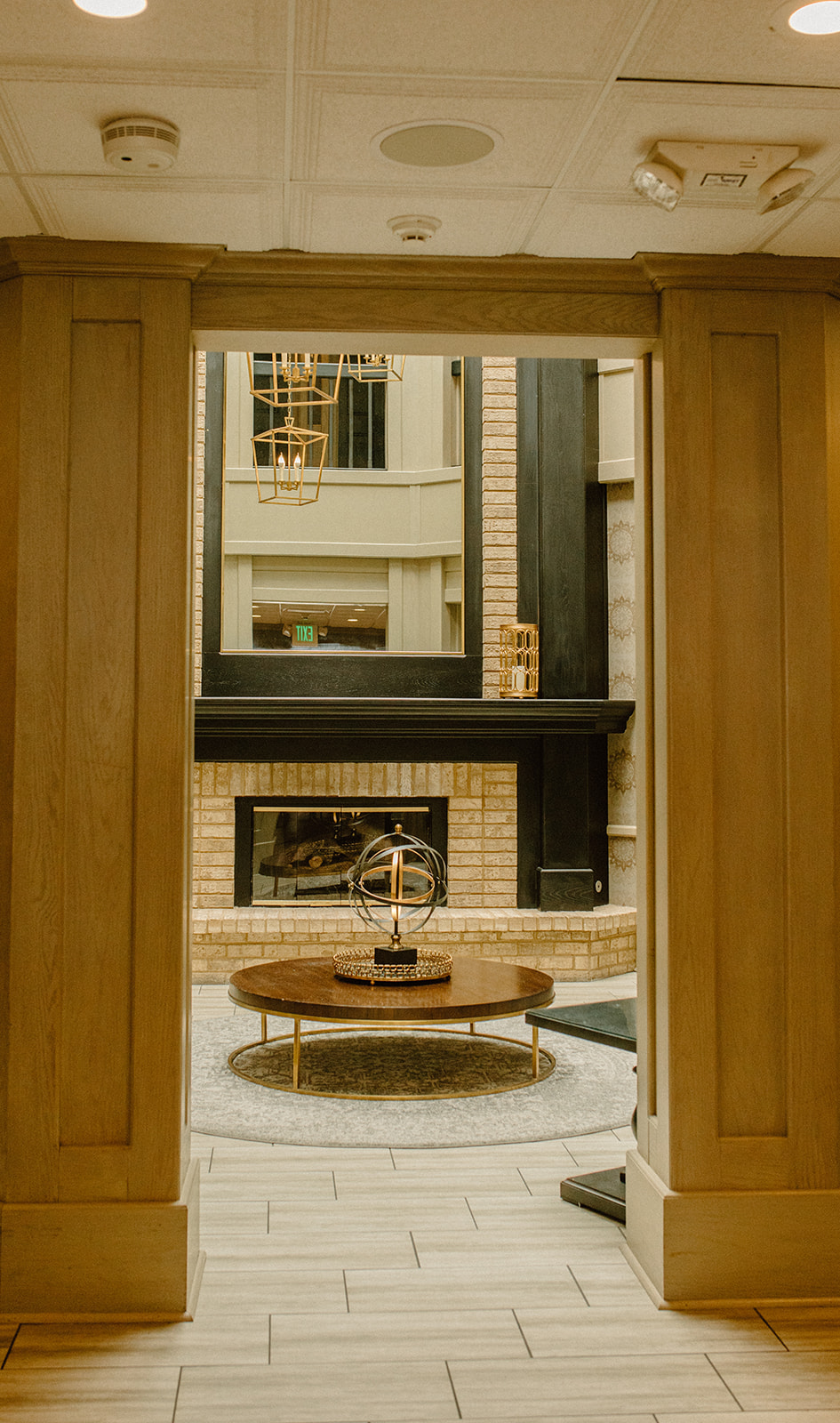 Elegant hotel lounge area featuring modern decor and a cozy fireplace, perfect for Lake Geneva wedding guests