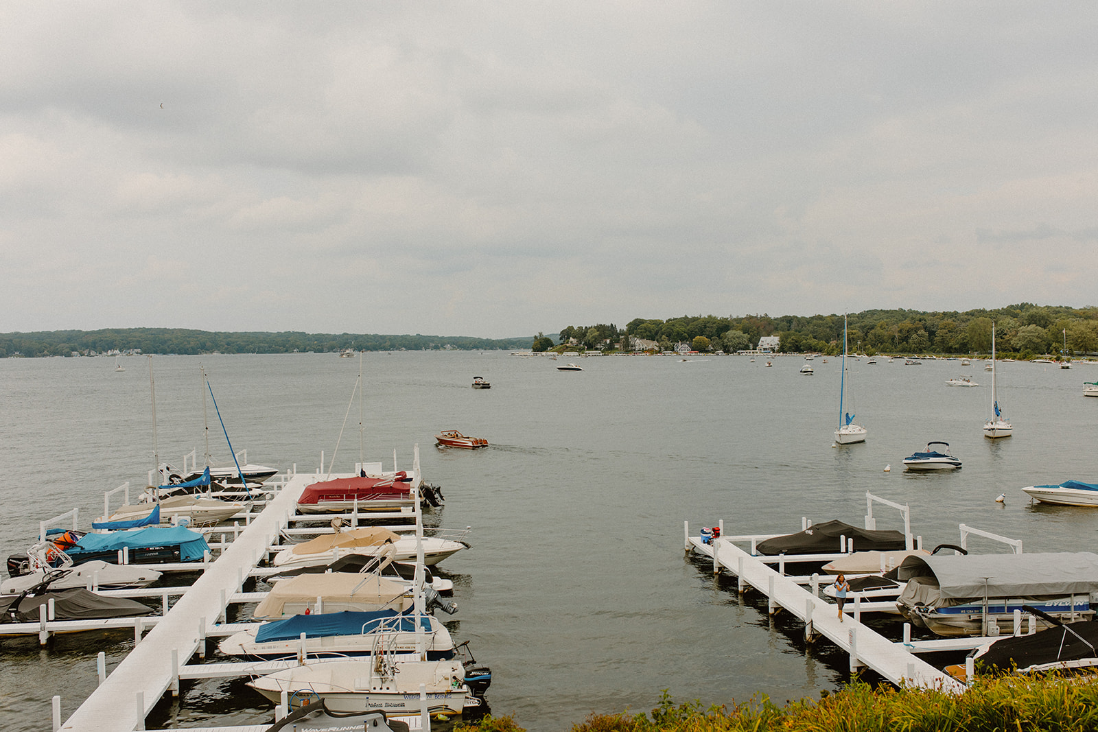 View of the marina with boats docked on a calm day in Lake Geneva, Wisconsin