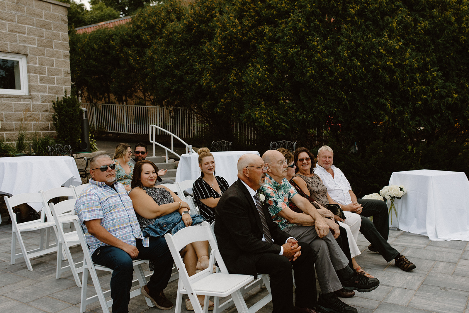 Guests seated and waiting for the ceremony to start at an intimate Lake Geneva wedding