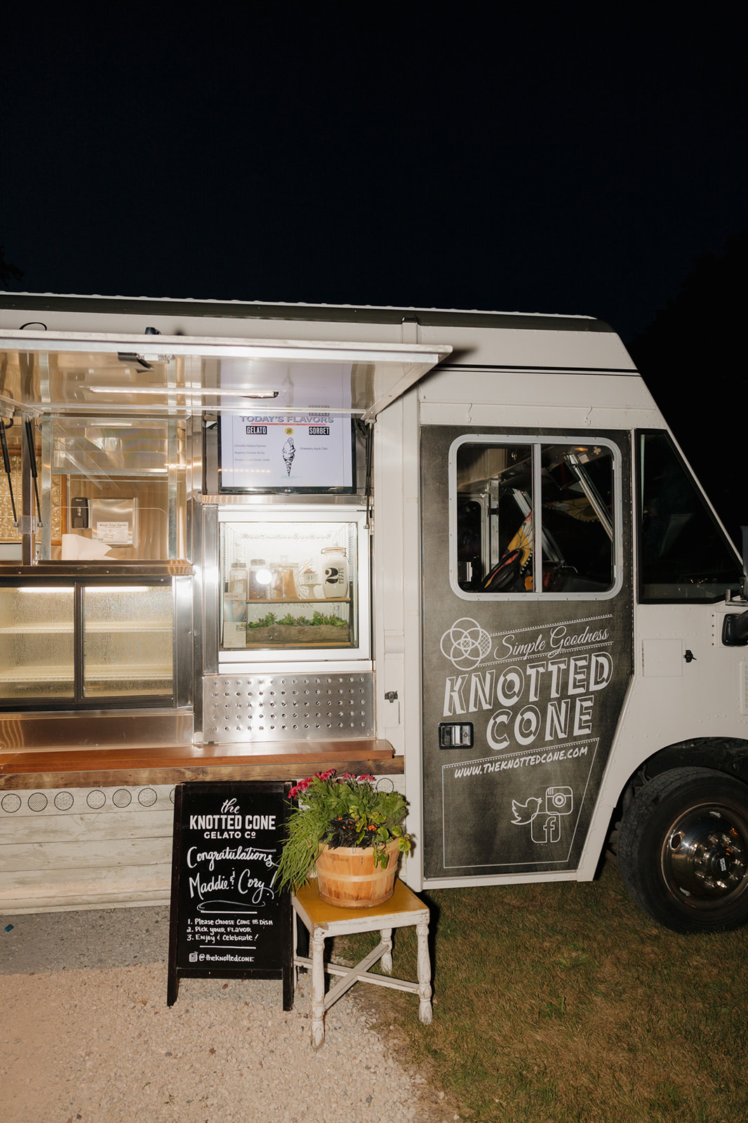Food truck with signs for the Knotted Cone Gelato Co. desserts for guests