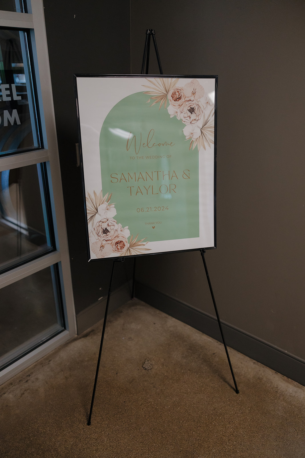 Elegant mint and blush wedding welcome sign for Samantha & Taylor, displayed at the entrance of a Wisconsin brewery wedding.