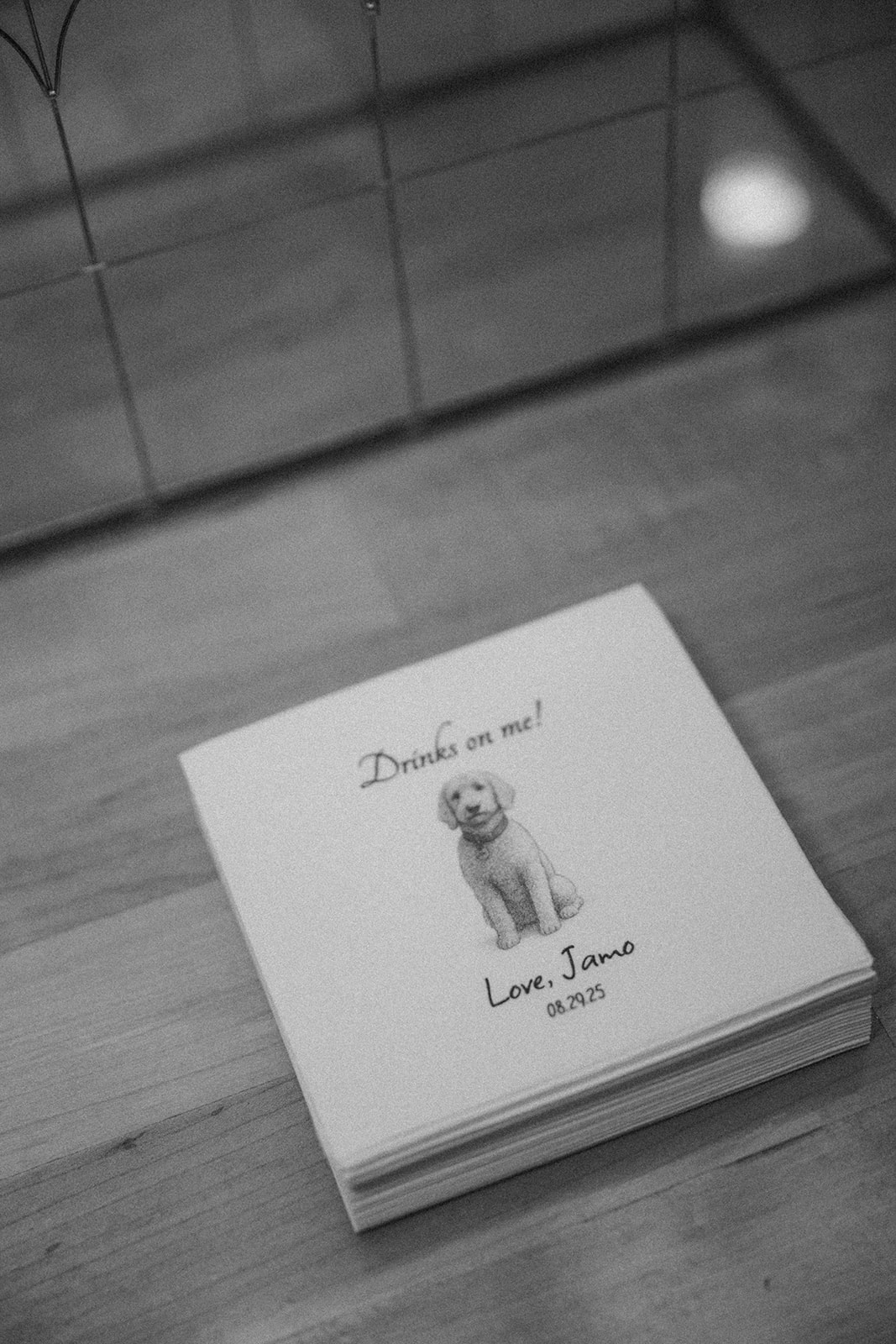 Cute napkins with couple's dog featuring 'drinks on me!' a cute and unique touch at the 10 South wedding venue