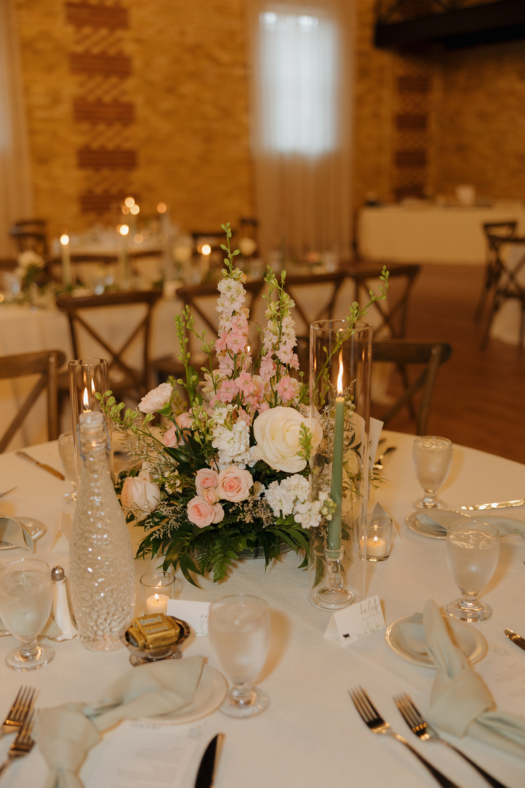 Elegant table adorned with flowers and candles, creating a charming atmosphere at the 10 South wedding venue.
