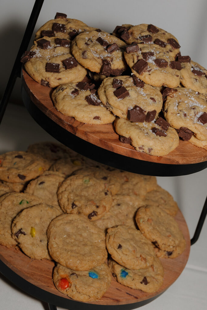 Tiered cookie display with chocolate chunk, oatmeal, and M&M cookies at a wedding in Wisconsin.