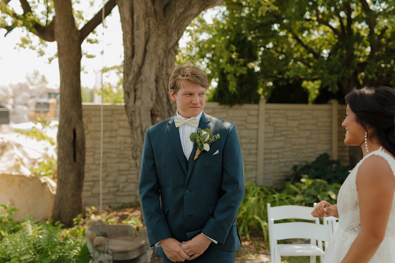 Groom sees bride for first time in wedding dress on wedding day in Milwaukee