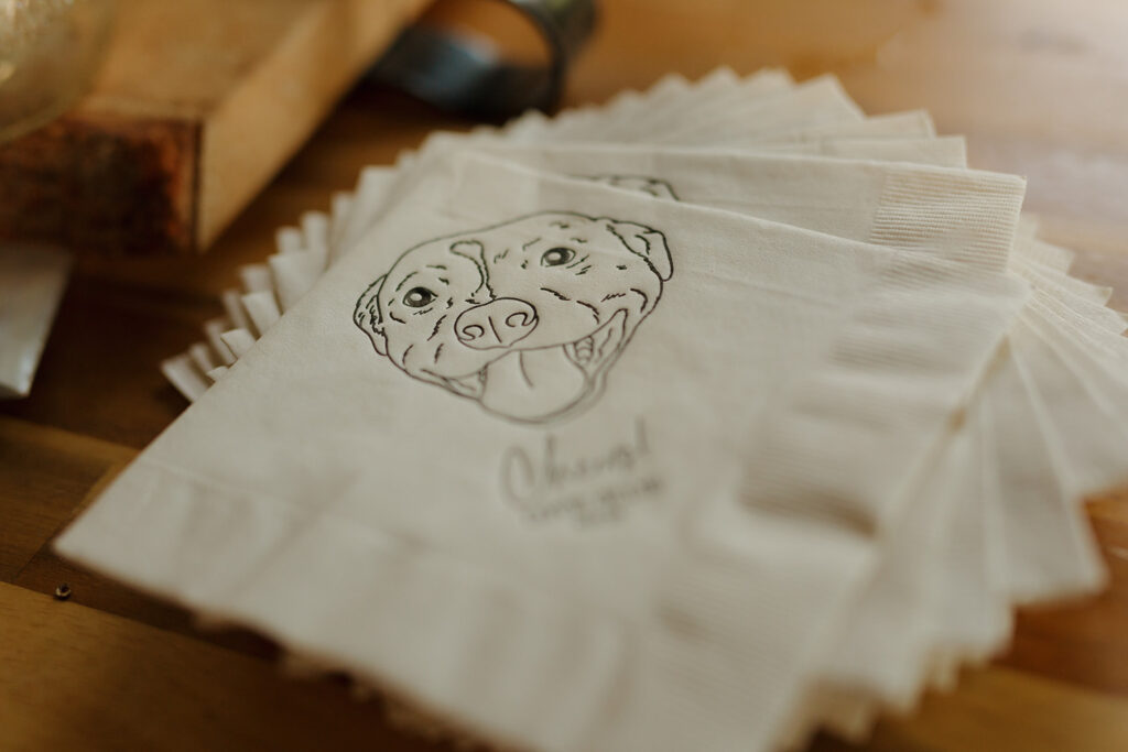 Close up of custom napkins of couple's dog's face at Milwaukee wedding venue reception