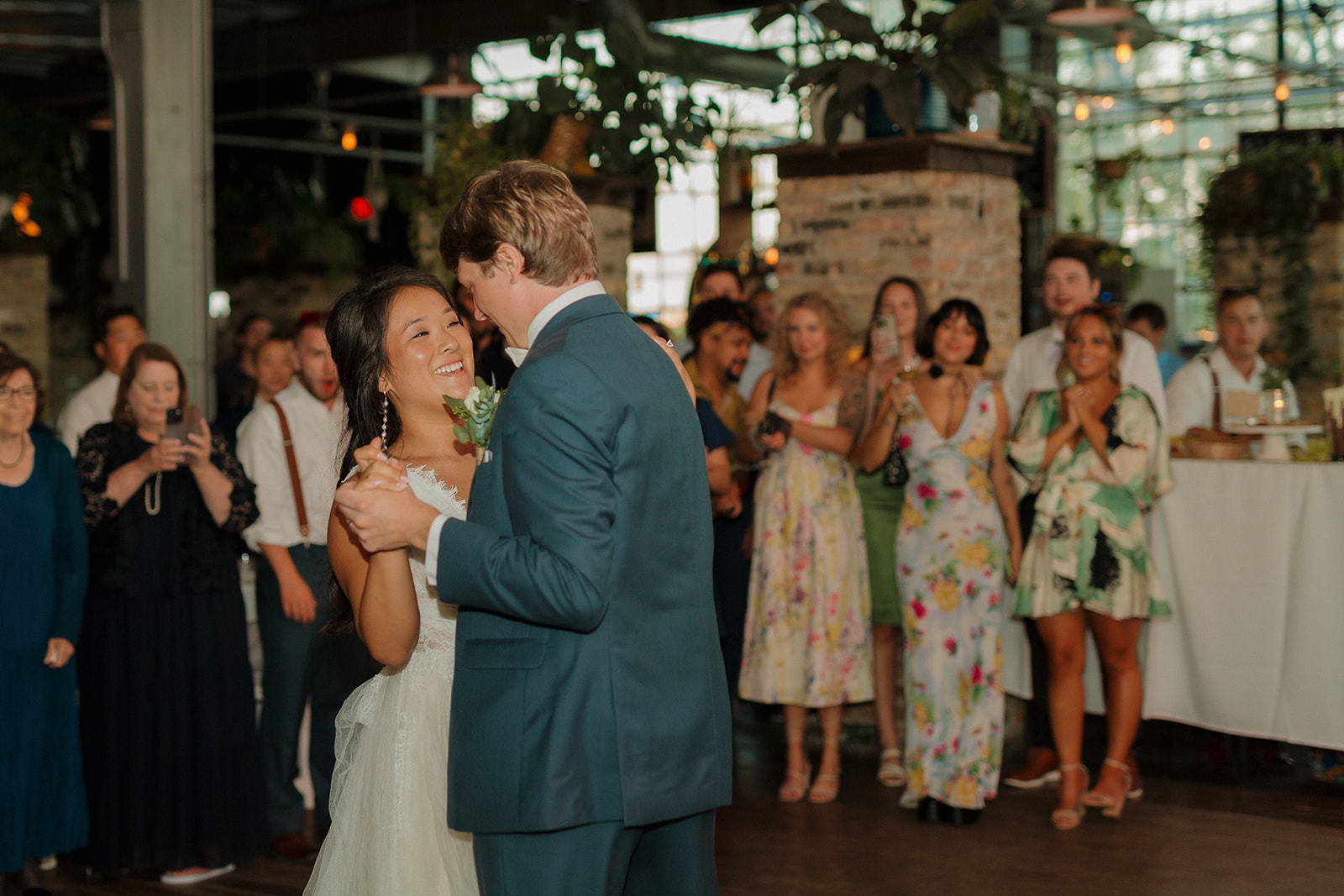 Bride and groom dance during first dance as husband and wife