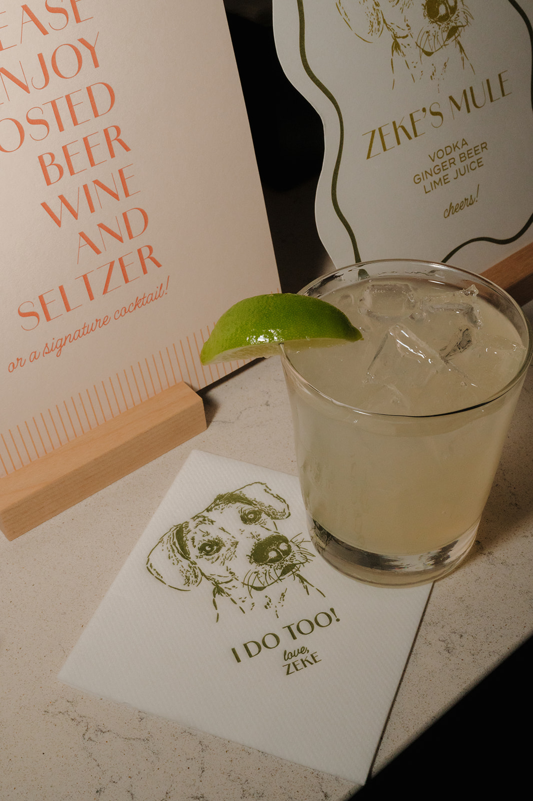 Signature cocktail and custom napkin with dog illustration at a Wisconsin wedding reception.