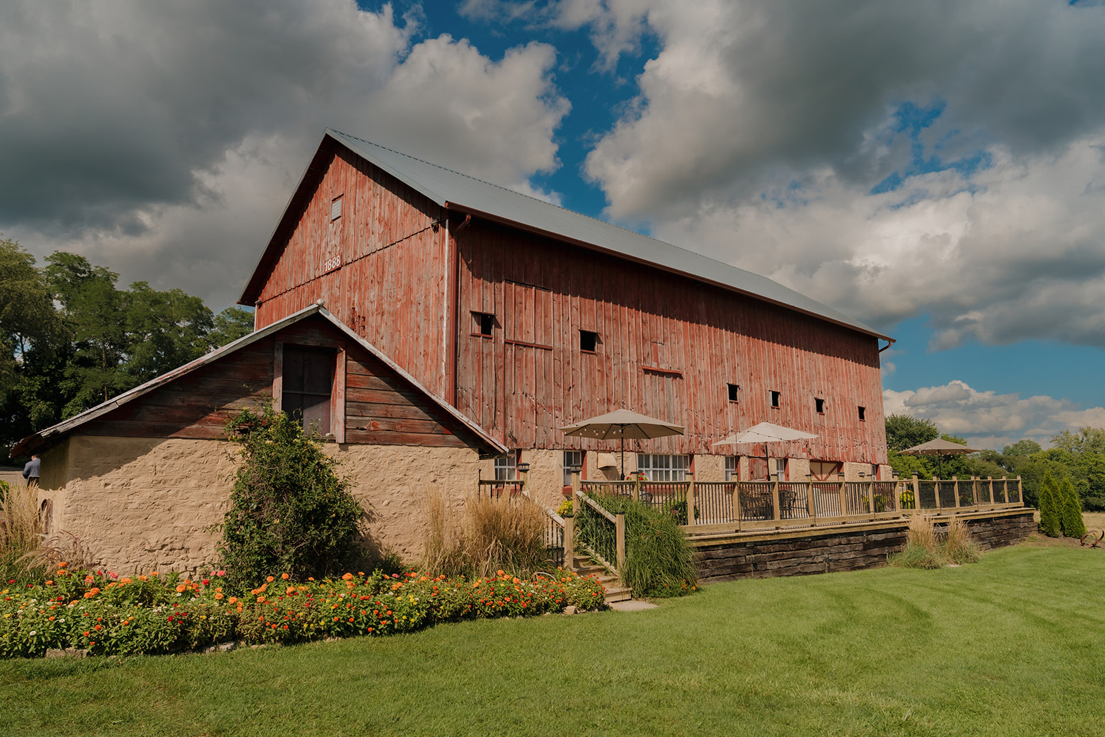 A charming barn venue with historic stone and wood architecture—proof that Madison wedding venues blend rustic roots with modern romance.