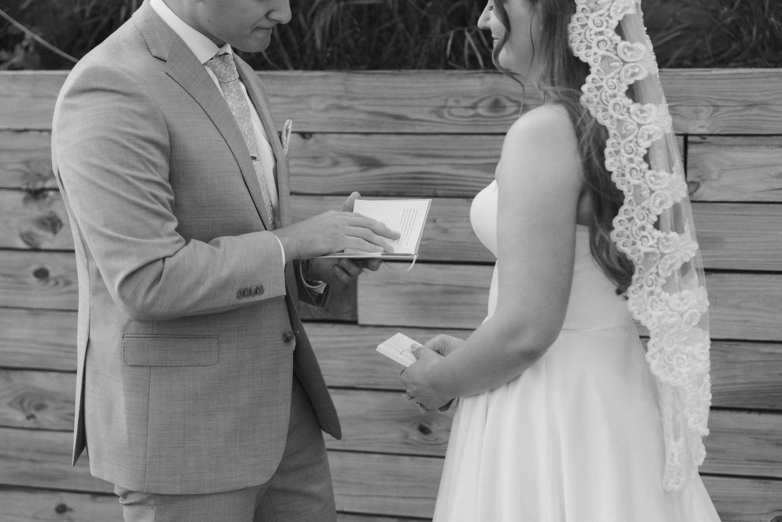 A heartfelt moment as the couple reads handwritten vows to each other—just one reason Madison wedding venues make space for connection.