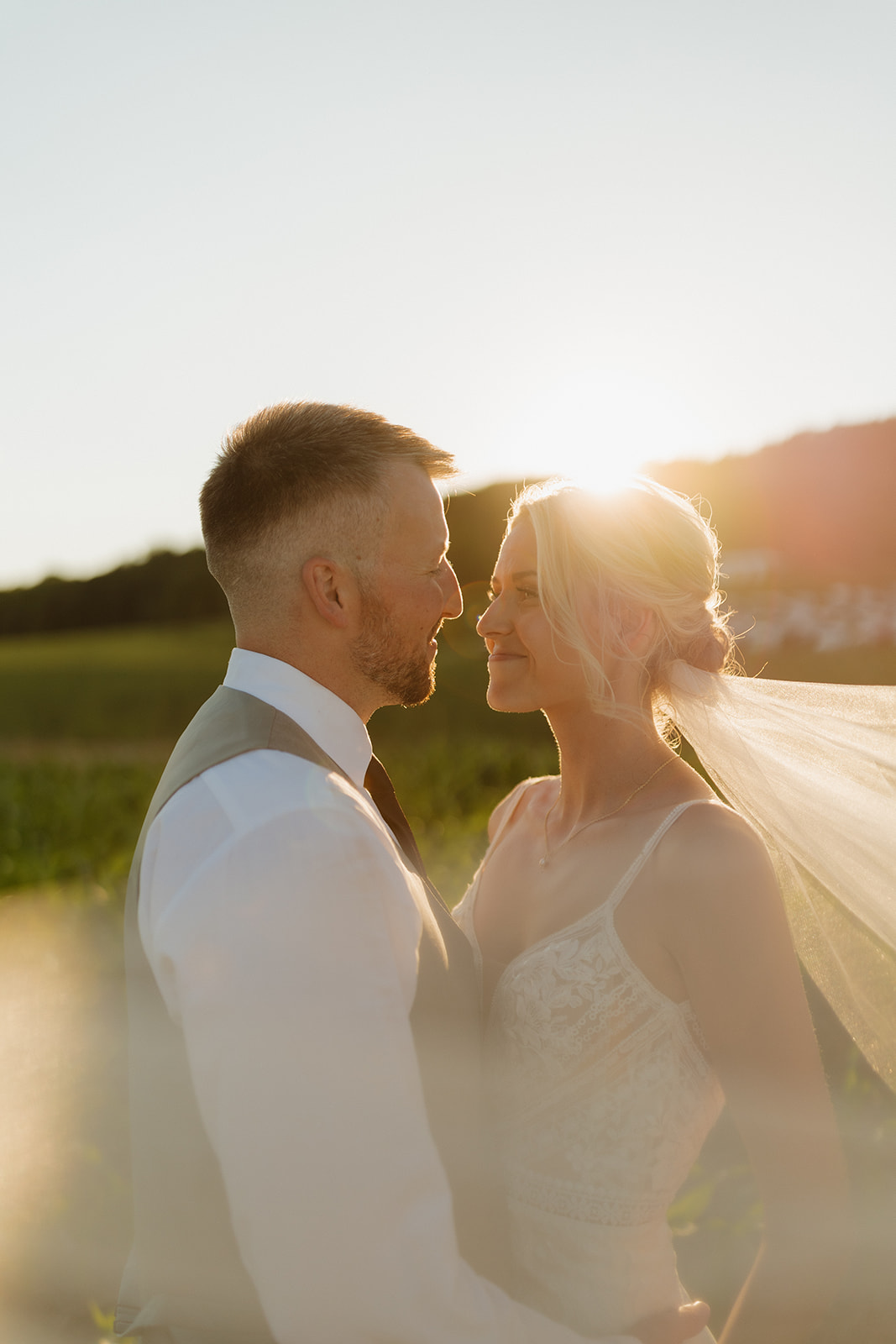 Bride and groom sharing a golden hour moment at a Wisconsin wedding venue.