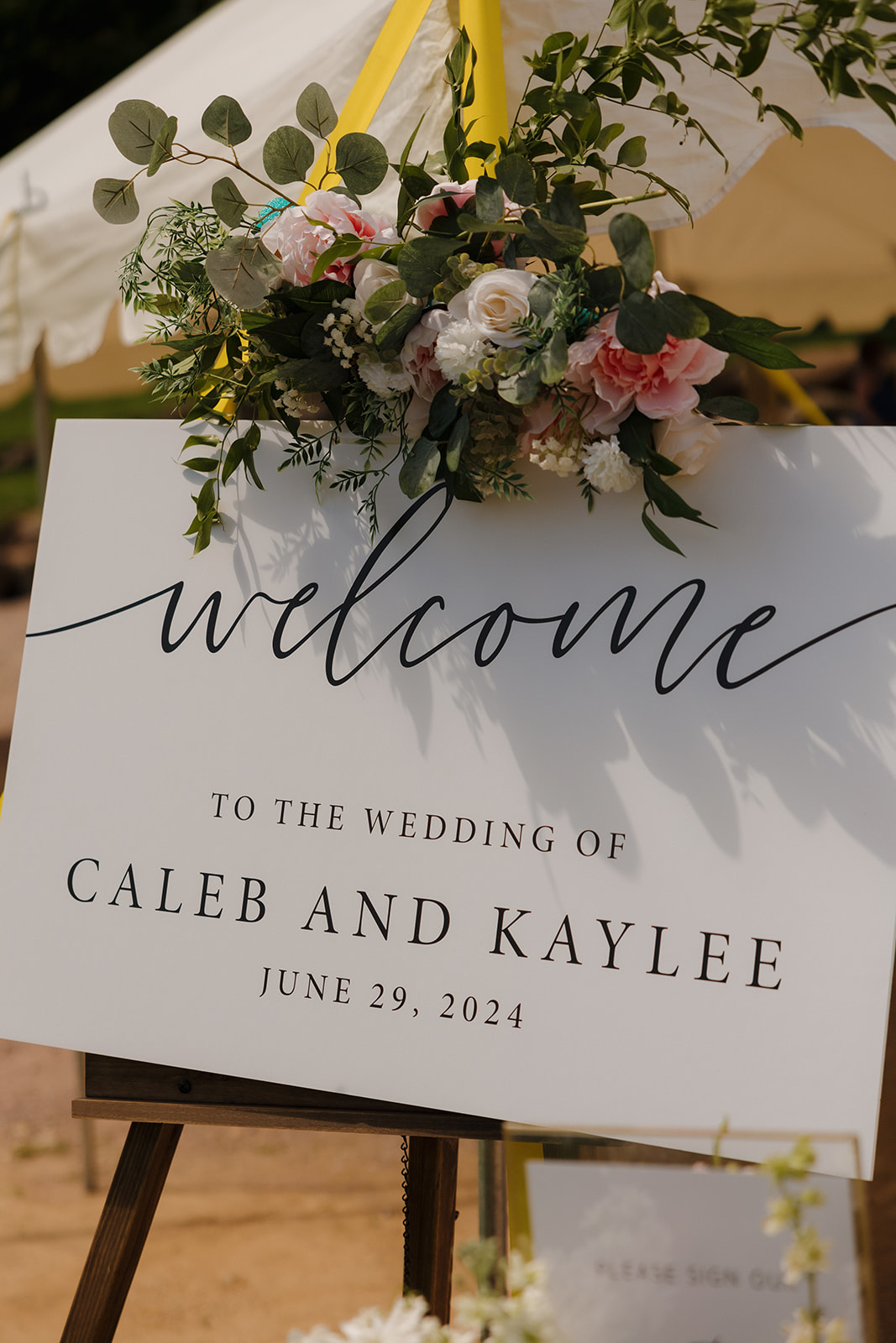 Elegant floral welcome sign for a vineyard ceremony at a Wisconsin wedding venue.
