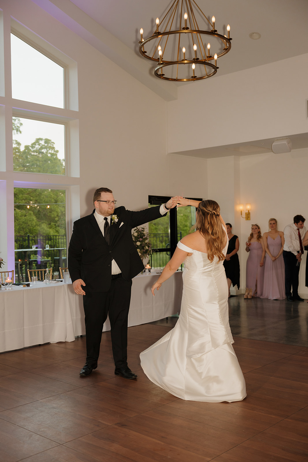 Bride and groom sharing first dance inside wedding venues in Wisconsin