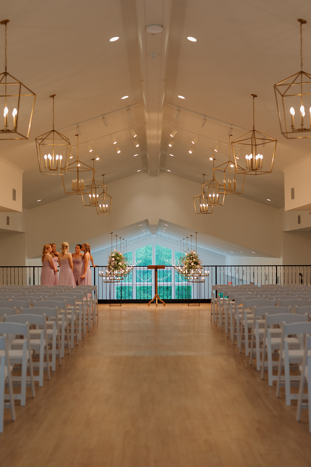 Symmetrical ceremony setup with floral arrangements at wedding venues in Wisconsin