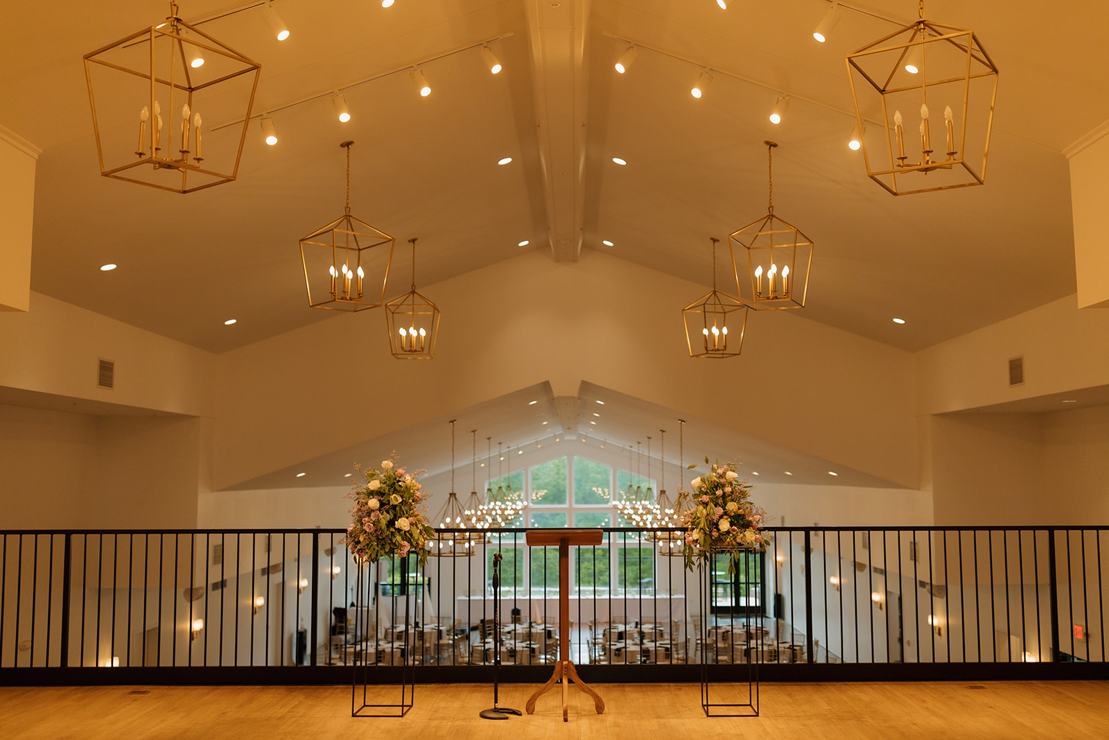 Ceremony space with vaulted ceilings and chandeliers at modern wedding venues in Wisconsin