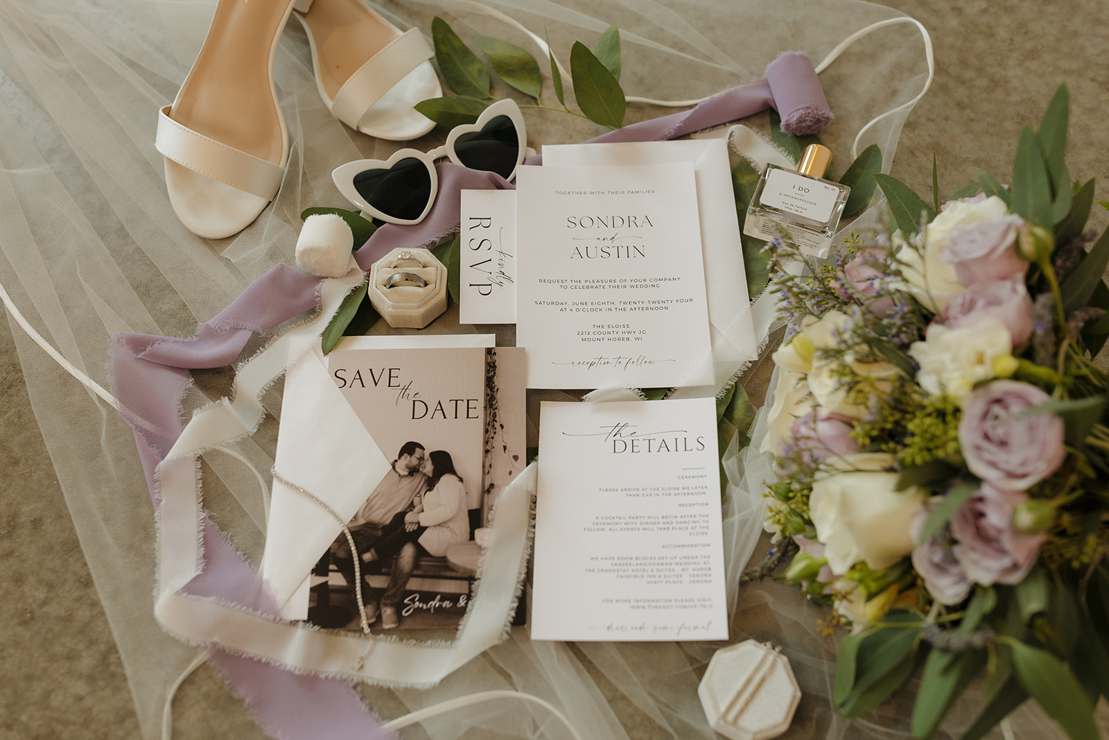 Flat lay of wedding invitation suite with florals at modern wedding venues in Wisconsin