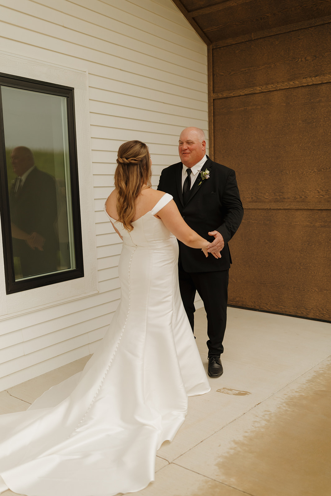 Father reacting emotionally during first look with bride at wedding venues in Wisconsin