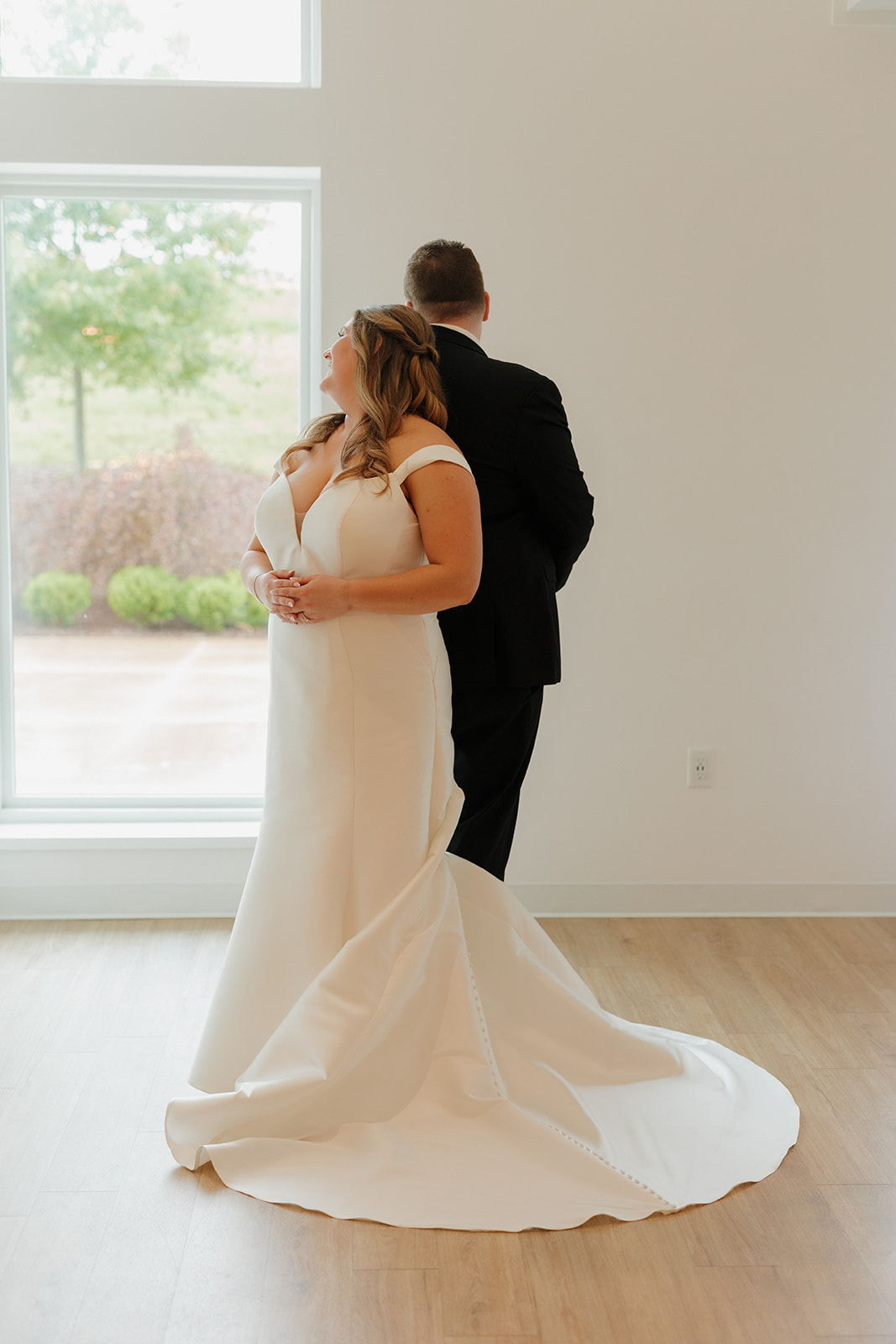 Bride and groom sharing a quiet moment in natural light at wedding venues in Wisconsin