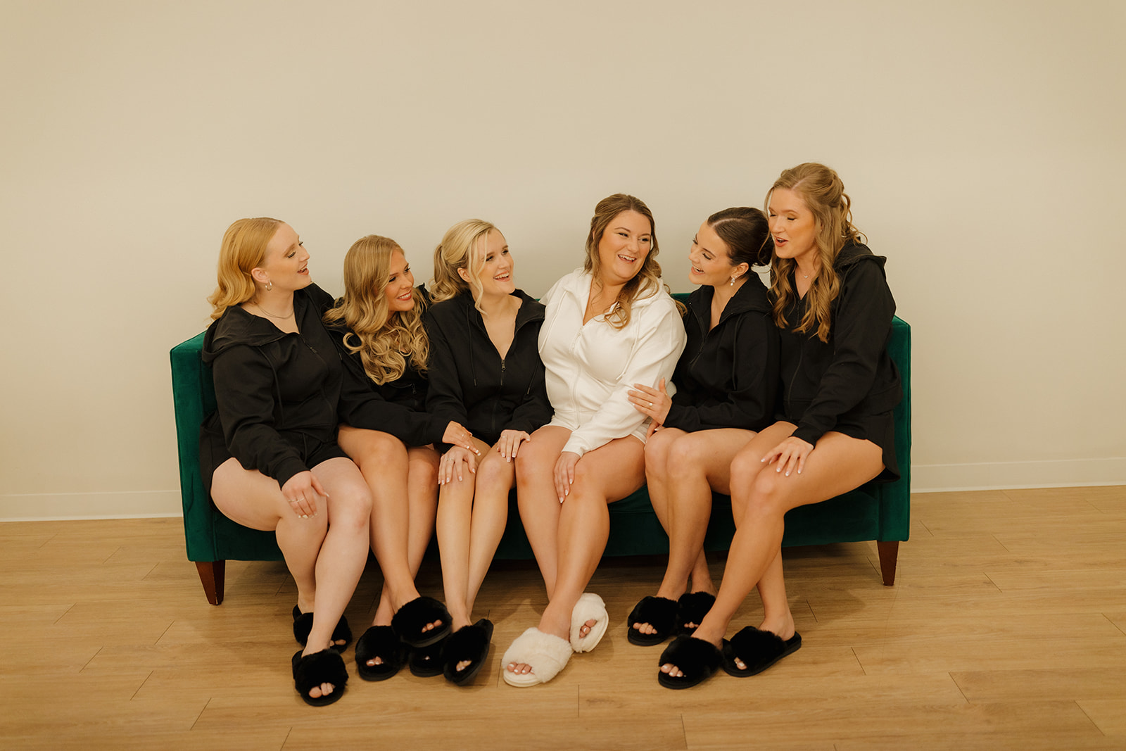 Bridal party laughing together in modern getting-ready space at wedding venues in Wisconsin