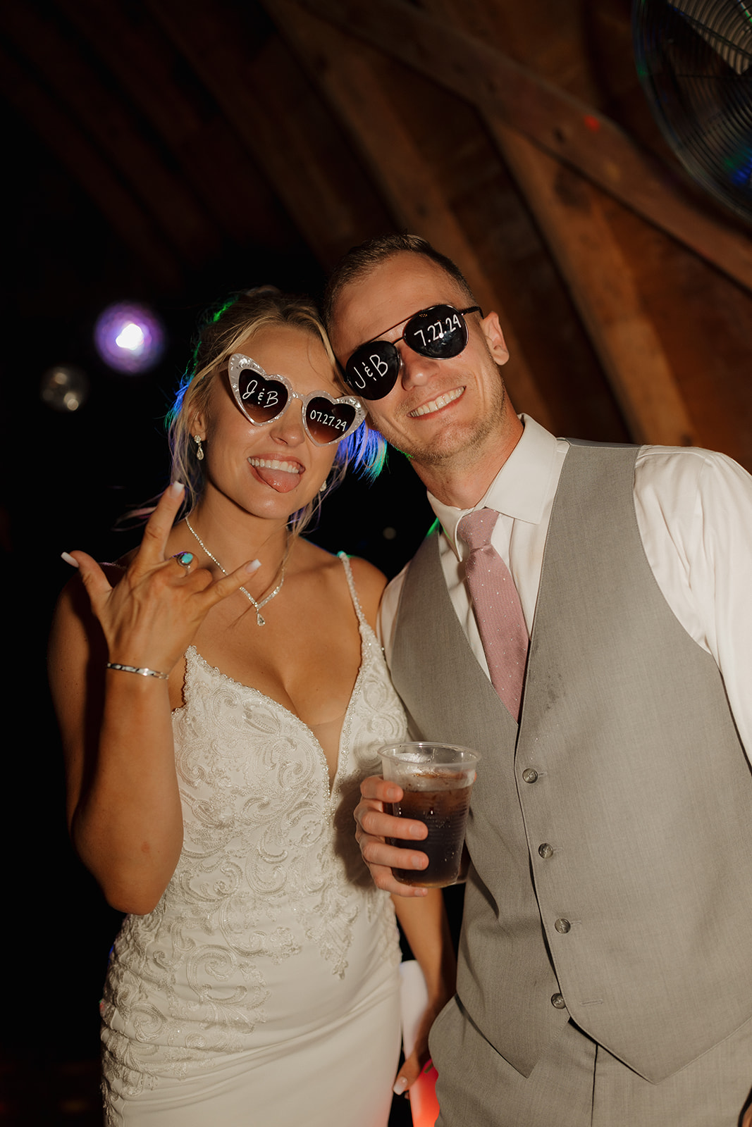 Bride and groom pose in custom wedding sunglasses—perfect detail for your wedding photography checklist gallery.