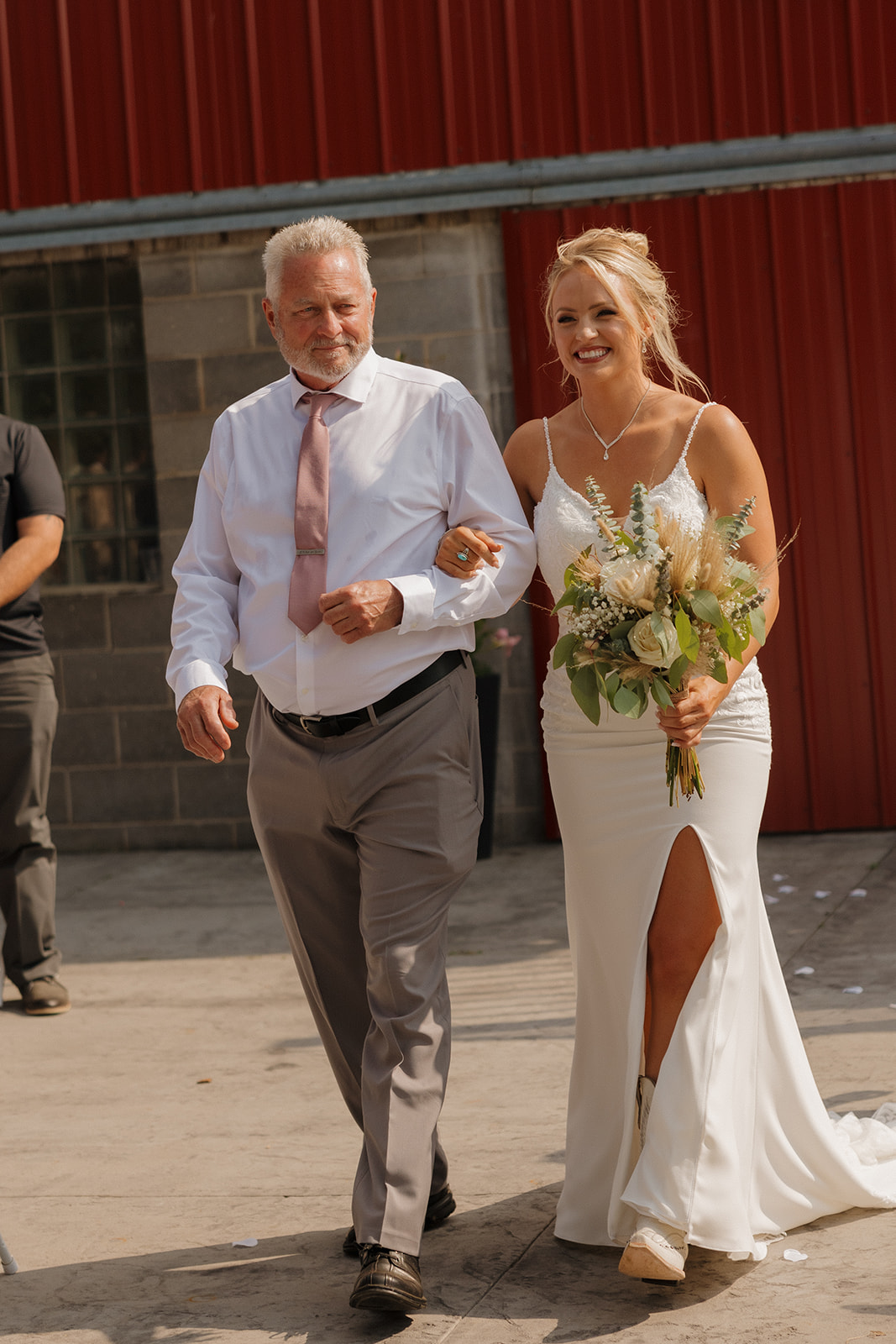 Bride walking down the aisle with her father, holding a bouquet of soft neutrals—one for the wedding photography checklist.