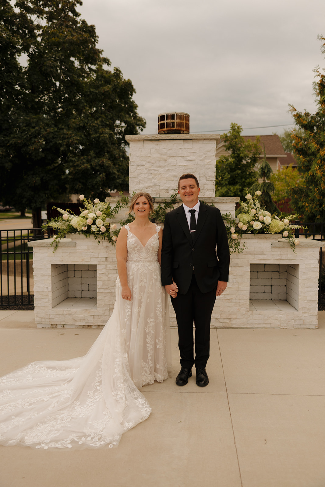 Newlywed couple standing together at an outdoor ceremony space at a wedding venue in Fort Myers Florida